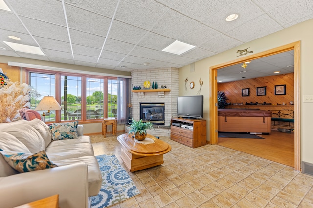 1422 Pier Dr, Lake Summerset, IL 61019 - living area featuring a drop ceiling, wooden walls, and a fireplace