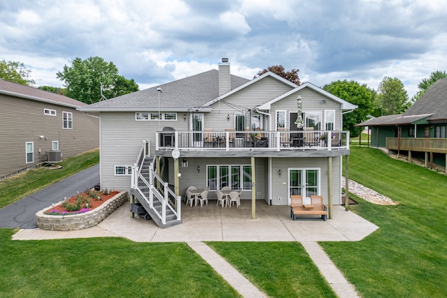 1422 Pier Dr, Lake Summerset, IL 61019 - back of property featuring stairs, a deck, a patio, a lawn, and a chimney