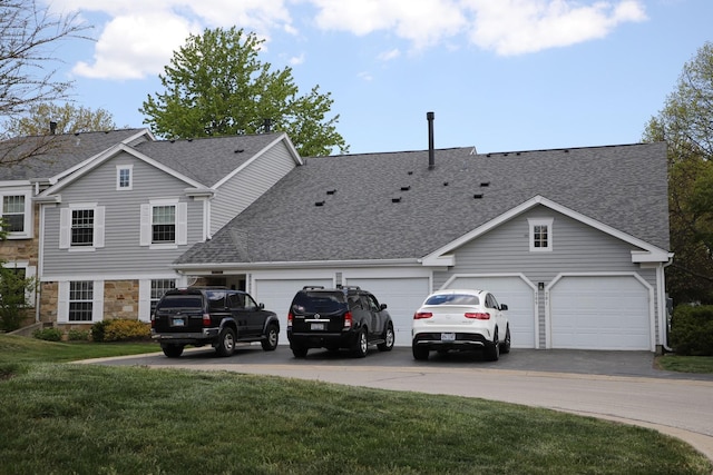 285 Ashland Ct Unit 1, Buffalo Grove, IL 60089 - traditional-style house with roof with shingles, concrete driveway, stone siding, a front yard, and a garage