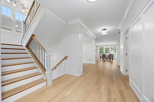 4508 Stonewall Ave, Downers Grove, IL 60515 - corridor featuring light wood-type flooring, a chandelier, and stairway