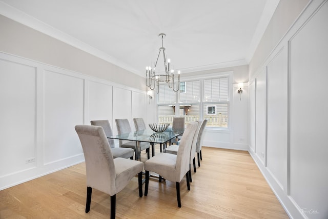 4508 Stonewall Ave, Downers Grove, IL 60515 - dining space featuring a decorative wall, a chandelier, light wood-style flooring, and ornamental molding