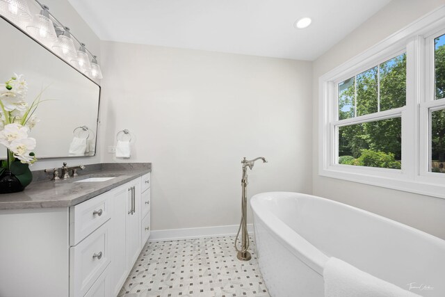 4508 Stonewall Ave, Downers Grove, IL 60515 - bathroom with tile patterned floors, vanity, a freestanding bath, and recessed lighting