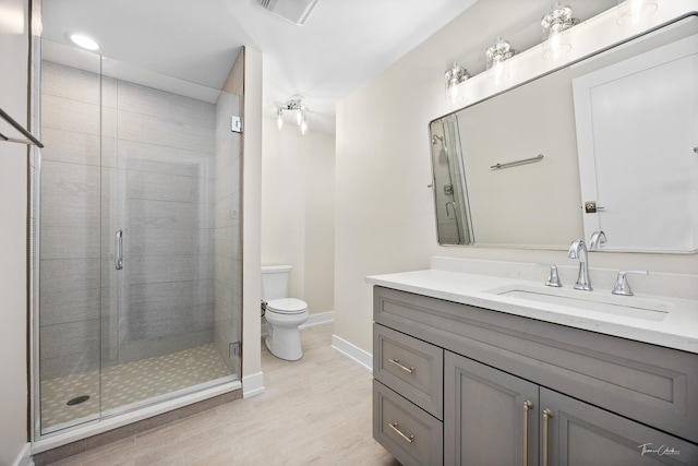 4508 Stonewall Ave, Downers Grove, IL 60515 - bathroom featuring vanity, wood finished floors, a shower stall, and recessed lighting
