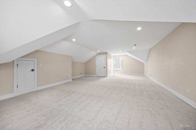 4508 Stonewall Ave, Downers Grove, IL 60515 - additional living space with light colored carpet, vaulted ceiling, and recessed lighting