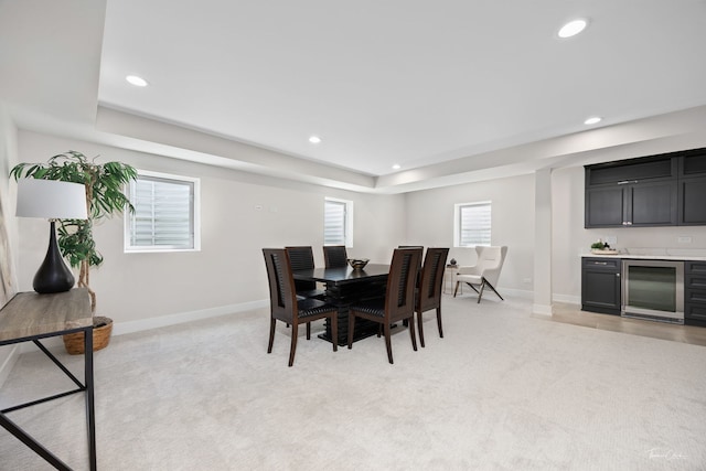 4508 Stonewall Ave, Downers Grove, IL 60515 - dining room featuring beverage cooler, a tray ceiling, wet bar, light carpet, and recessed lighting