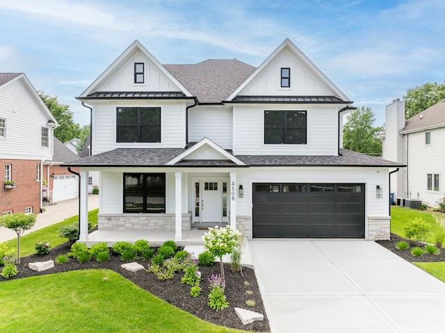4508 Stonewall Ave, Downers Grove, IL 60515 - modern farmhouse style home with a porch, board and batten siding, a garage, a standing seam roof, and a shingled roof