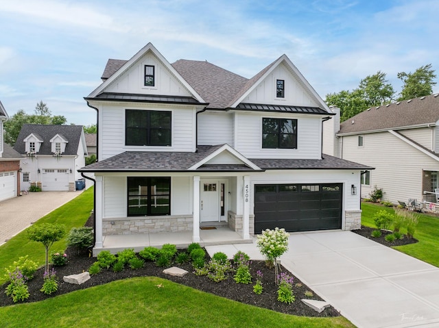 4508 Stonewall Ave, Downers Grove, IL 60515 - modern inspired farmhouse with stone siding, board and batten siding, concrete driveway, and a shingled roof