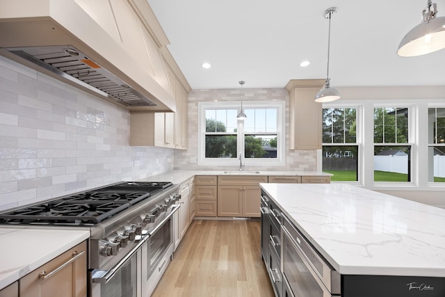 4508 Stonewall Ave, Downers Grove, IL 60515 - kitchen with double oven range, extractor fan, light wood-type flooring, tasteful backsplash, and pendant lighting
