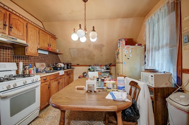 5145 S Troy St, Chicago, IL 60632 - kitchen featuring white appliances, under cabinet range hood, a chandelier, light countertops, and brown cabinets
