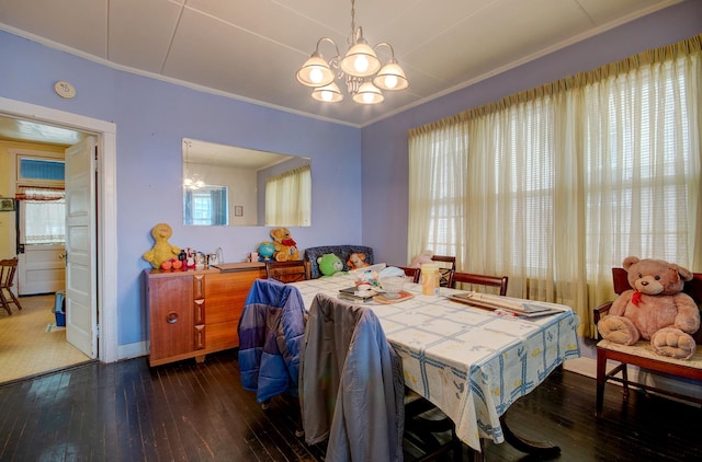5145 S Troy St, Chicago, IL 60632 - dining room featuring a chandelier, hardwood / wood-style floors, and crown molding