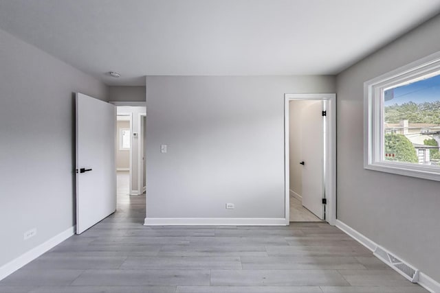 8433 W Betty Ter W, Niles, IL 60714 - unfurnished bedroom with light wood-type flooring