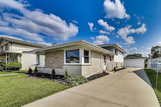 8433 W Betty Ter W, Niles, IL 60714 - view of front facade featuring brick siding, an outdoor structure, a front yard, and a detached garage