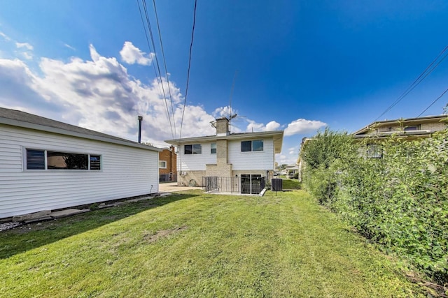8433 W Betty Ter W, Niles, IL 60714 - back of house featuring a chimney and a yard
