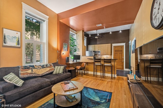 909 W Wisconsin St Unit 1M, Chicago, IL 60614 - living room with wood finished floors, track lighting, and ceiling fan