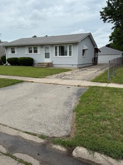 4714 Pine Al St, Machesney Park, IL 61115 - single story home with a front lawn and a detached garage