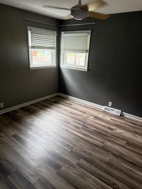 4714 Pine Al St, Machesney Park, IL 61115 - empty room featuring ceiling fan and dark wood-style flooring