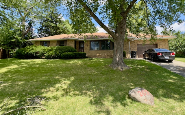 207 Dodge Ave, Danville, IL 61832 - single story home featuring a garage, driveway, brick siding, and a front yard
