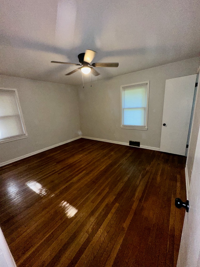 207 Dodge Ave, Danville, IL 61832 - spare room with dark wood-type flooring, ceiling fan, and a textured ceiling