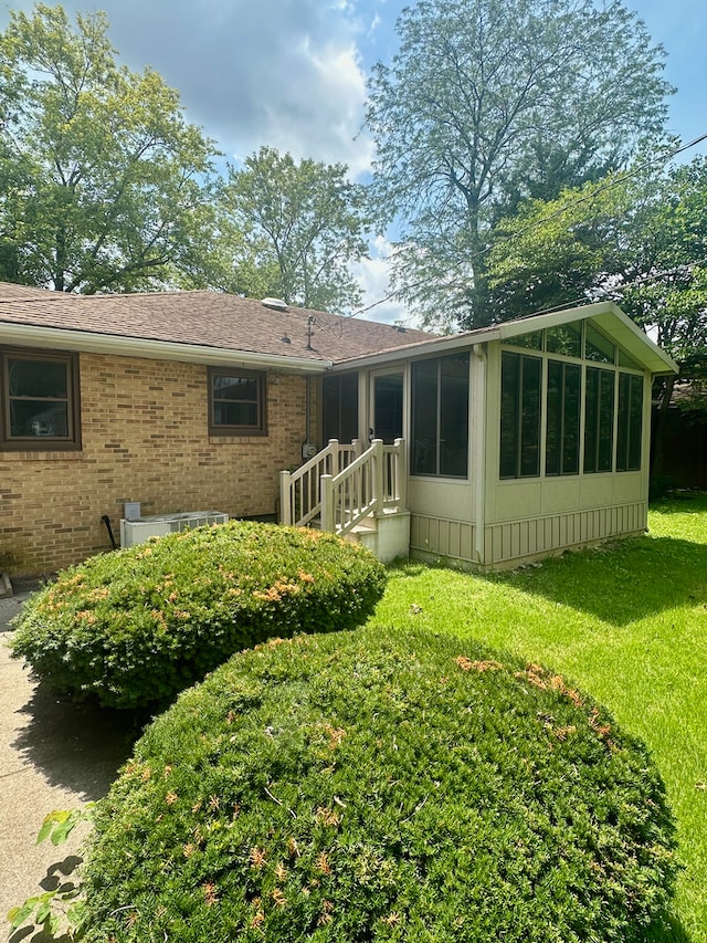 207 Dodge Ave, Danville, IL 61832 - back of property with brick siding and a lawn