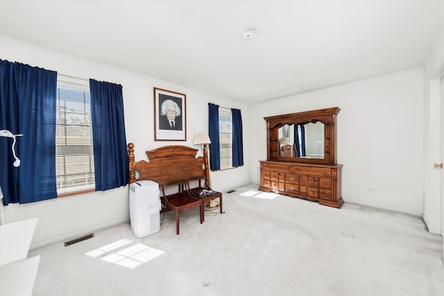 43 Freesia Ct, Romeoville, IL 60446 - living area featuring healthy amount of natural light and carpet floors
