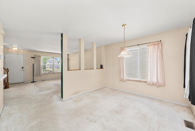 43 Freesia Ct, Romeoville, IL 60446 - unfurnished dining area with carpet flooring and baseboards