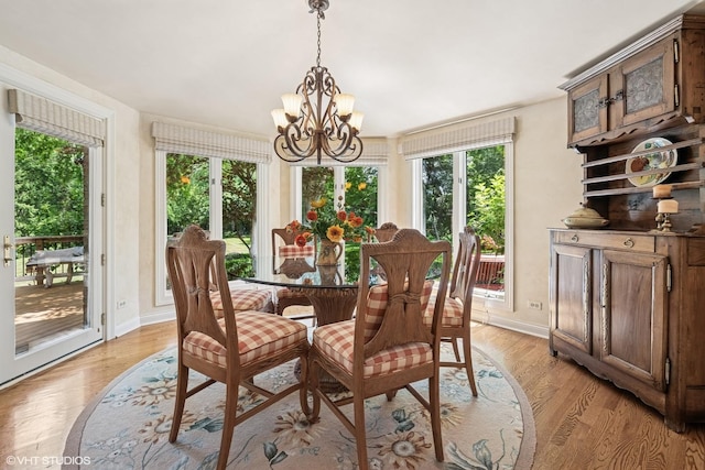 85 Ela Rd, Inverness, IL 60067 - dining room with a chandelier and light wood-style flooring