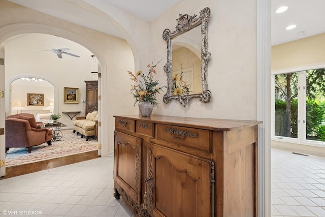 85 Ela Rd, Inverness, IL 60067 - corridor with arched walkways, light tile patterned floors, and recessed lighting