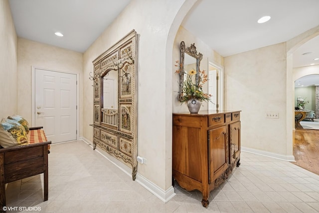 85 Ela Rd, Inverness, IL 60067 - corridor with arched walkways, light tile patterned flooring, and recessed lighting