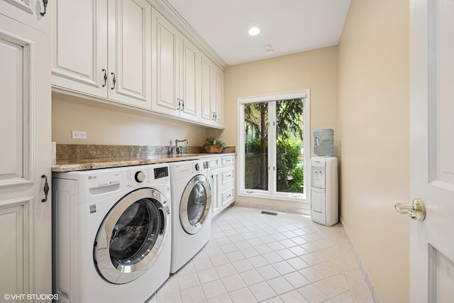 85 Ela Rd, Inverness, IL 60067 - laundry area with washing machine and clothes dryer, light tile patterned flooring, cabinet space, and recessed lighting