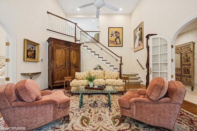85 Ela Rd, Inverness, IL 60067 - living room featuring arched walkways, stairs, a towering ceiling, a ceiling fan, and recessed lighting