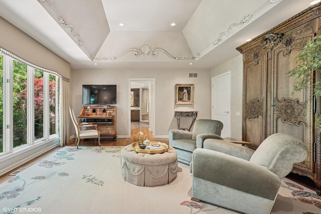 85 Ela Rd, Inverness, IL 60067 - living room with a tray ceiling, recessed lighting, wood finished floors, and lofted ceiling