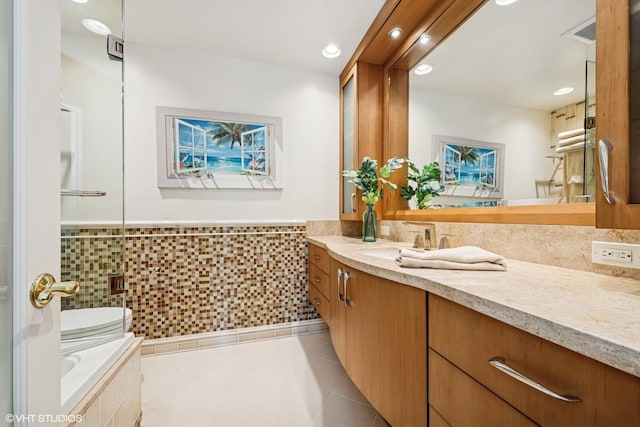 85 Ela Rd, Inverness, IL 60067 - bathroom with vanity, tile patterned floors, wainscoting, tile walls, and tiled bath