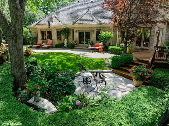 85 Ela Rd, Inverness, IL 60067 - rear view of property featuring french doors, a wooden deck, brick siding, and a patio