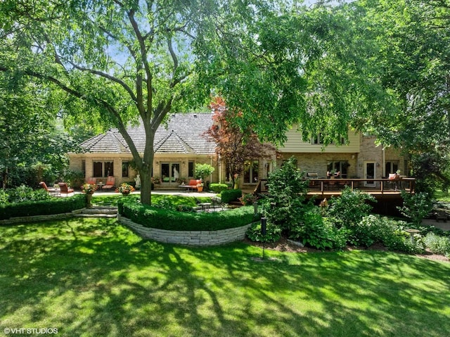 85 Ela Rd, Inverness, IL 60067 - rear view of house featuring a yard, a deck, a patio, and stone siding