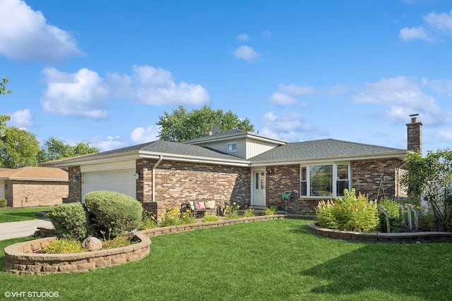 8437 167th St, Tinley Park, IL 60487 - tri-level home with an attached garage, a chimney, brick siding, and a front yard