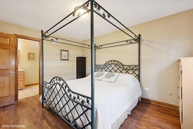 8437 167th St, Tinley Park, IL 60487 - bedroom featuring hardwood / wood-style floors and connected bathroom