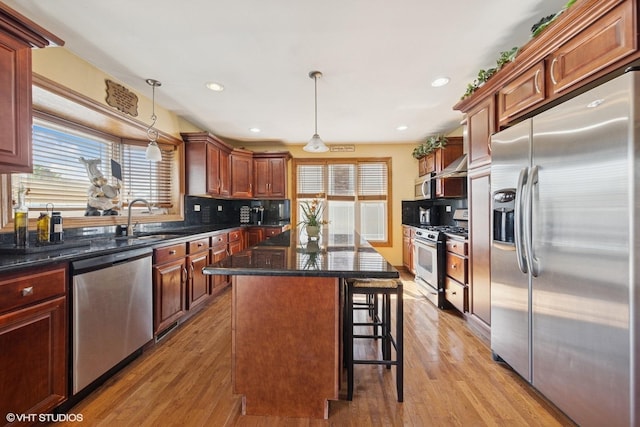 8437 167th St, Tinley Park, IL 60487 - kitchen with stainless steel appliances, healthy amount of natural light, a center island, backsplash, and recessed lighting