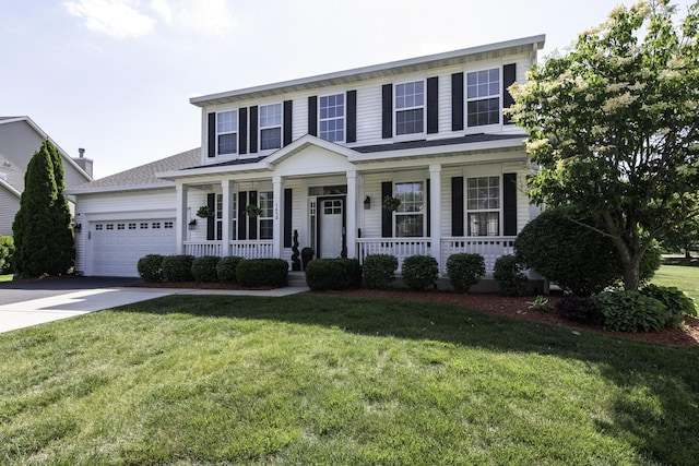 1650 Natures Way, Lindenhurst, IL 60046 - view of front facade with a porch, driveway, a garage, and a front lawn