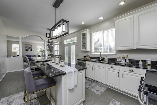 1650 Natures Way, Lindenhurst, IL 60046 - kitchen with ornate columns, dark countertops, white cabinets, dark tile patterned flooring, and recessed lighting