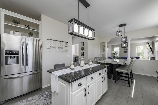 1650 Natures Way, Lindenhurst, IL 60046 - kitchen featuring stainless steel refrigerator with ice dispenser, ornate columns, open shelves, a center island, and white cabinetry