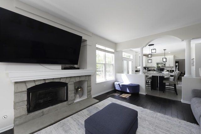 1650 Natures Way, Lindenhurst, IL 60046 - living room featuring decorative columns, wood-type flooring, and a fireplace