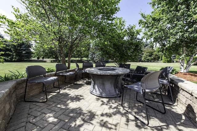 1650 Natures Way, Lindenhurst, IL 60046 - view of patio featuring an outdoor fire pit and view of scattered trees