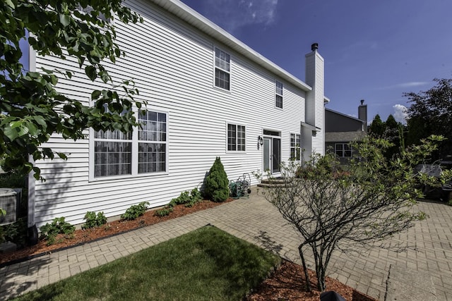 1650 Natures Way, Lindenhurst, IL 60046 - back of property with a patio area, a chimney, and entry steps