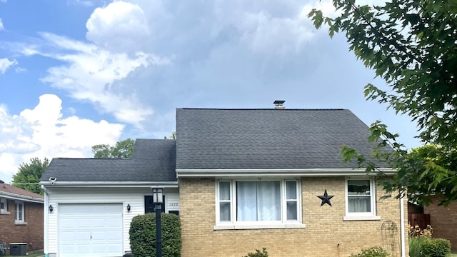1620 S 5th Ave, Kankakee, IL 60901 - view of front of house with a garage, brick siding, and a shingled roof