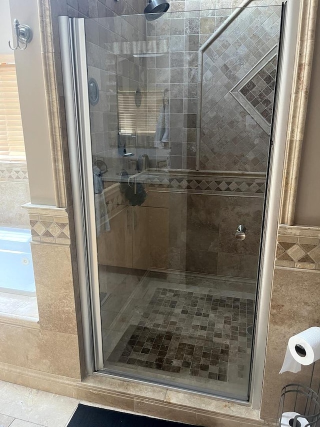 1620 S 5th Ave, Kankakee, IL 60901 - bathroom featuring a stall shower, wainscoting, and tile walls