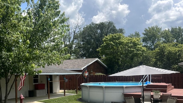 1620 S 5th Ave, Kankakee, IL 60901 - view of swimming pool featuring a fenced backyard and a wooden deck