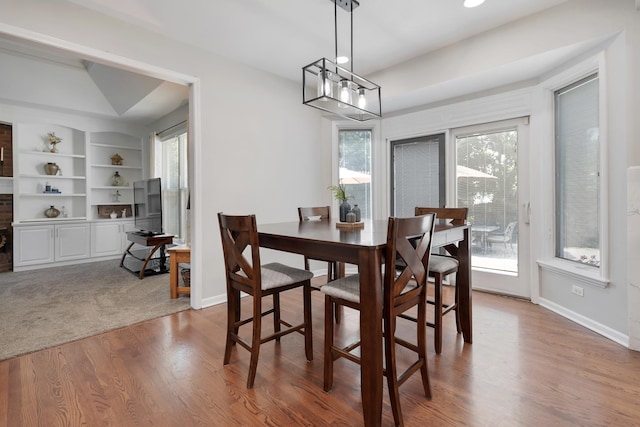 262 Hawk Hollow Dr, Bartlett, IL 60103 - dining space with healthy amount of natural light, wood finished floors, a chandelier, recessed lighting, and built in shelves