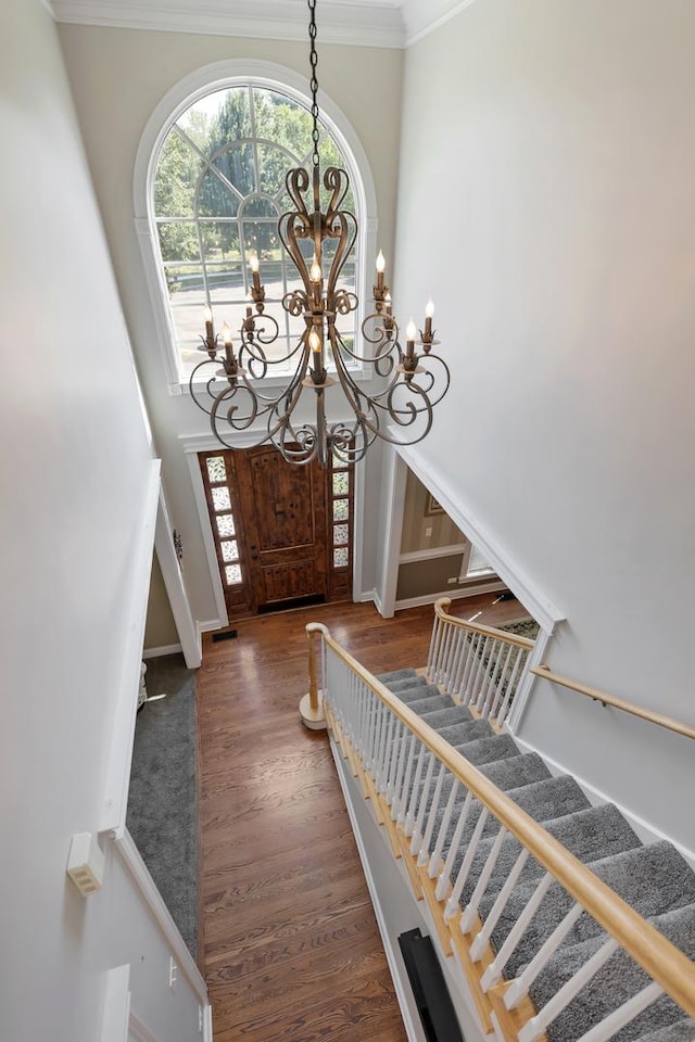 262 Hawk Hollow Dr, Bartlett, IL 60103 - entryway featuring a chandelier, plenty of natural light, stairway, a high ceiling, and crown molding