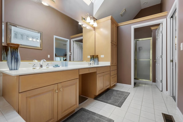 262 Hawk Hollow Dr, Bartlett, IL 60103 - bathroom with double vanity, a shower stall, lofted ceiling, and tile patterned floors
