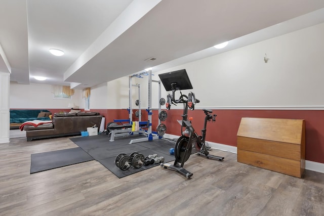 262 Hawk Hollow Dr, Bartlett, IL 60103 - exercise room with wood finished floors and baseboards